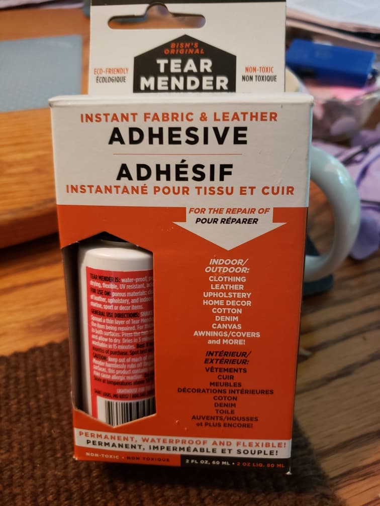 A boxed bottle of Tear Mender instant fabric and leather adhesive
